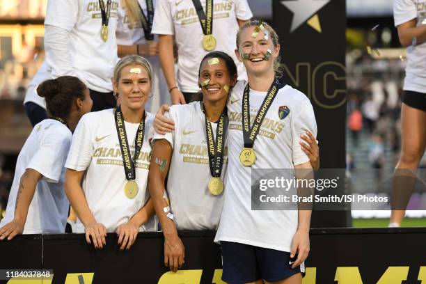 Merritt Mathias of the North Carolina Courage celebrates with teammates Lynn Williams and Samantha Mewis after a game between Chicago Red Stars and...