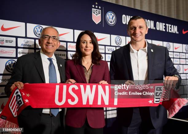 Carlos Cordeiro, U.S. Soccer President, and Kate Markgraf, U.S. Women’s National Team General Manager, pose for a photo with Vlatko Andonovski at a...