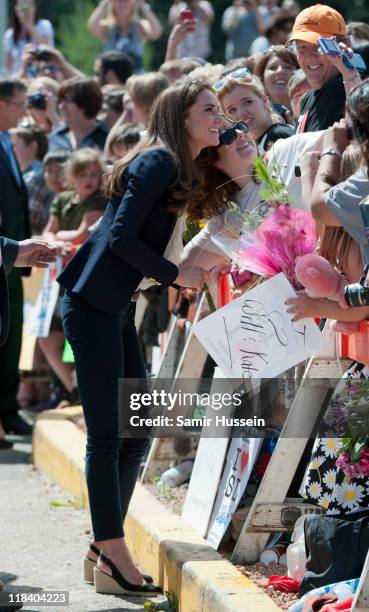 Catherine, Duchess of Cambridge meets well wishers as she visits a part of town devastated by a fire in May 2011 on July 7, 2011 in Slave Lake,...