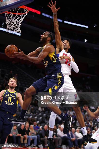 Warren of the Indiana Pacers drives to the basket past Christian Wood of the Detroit Pistons during the first half at Little Caesars Arena on October...