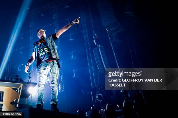 Didier Morville, aka JoeyStarr, of the French rap band "Supreme NTM" performs on stage during a concert at the AccorHotels Arena, in Paris on...