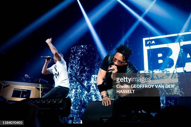 Didier Morville aka JoeyStarr , and Bruno Lopes aka Kool Shen, of the French rap band "Supreme NTM" perform on stage during a concert at the...