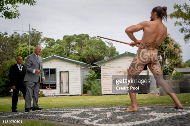 Prince Charles, Prince of Wales takes part in Maori challenge during a visit to Takahanga Marae on November 23, 2019 in Kaikoura, New Zealand. The...