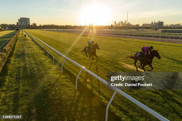 Glenn Boss riding Constantinople and Jye McNeil riding Huntly Castle during a trackwork session at Flemington Racecourse on October 29, 2019 in...