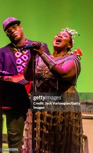 South African singer Thandiswa Mazwai performs with her band with American musician Tarus Mateen on electric bass guitar at a free concert in the...