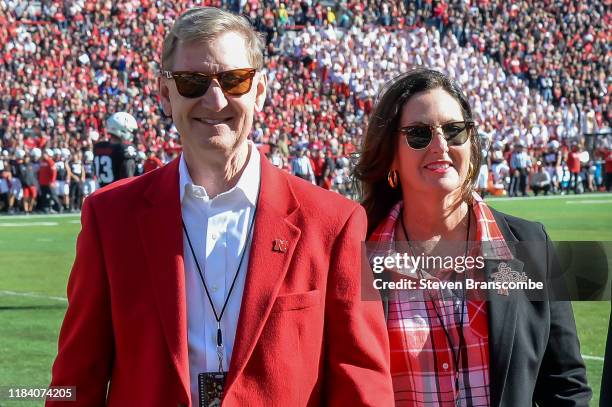 Retired Vice Admiral Walter "Ted" Carter and his wife Linda Carter are recognized during a break in the game between the Nebraska Cornhuskers and the...