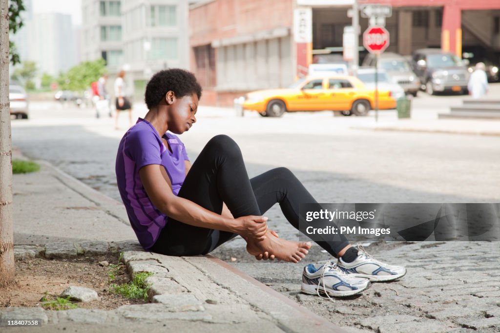 Injured jogger on city street