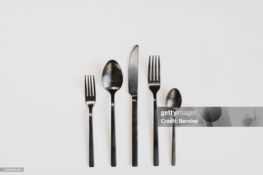 Black cutlery on a white background