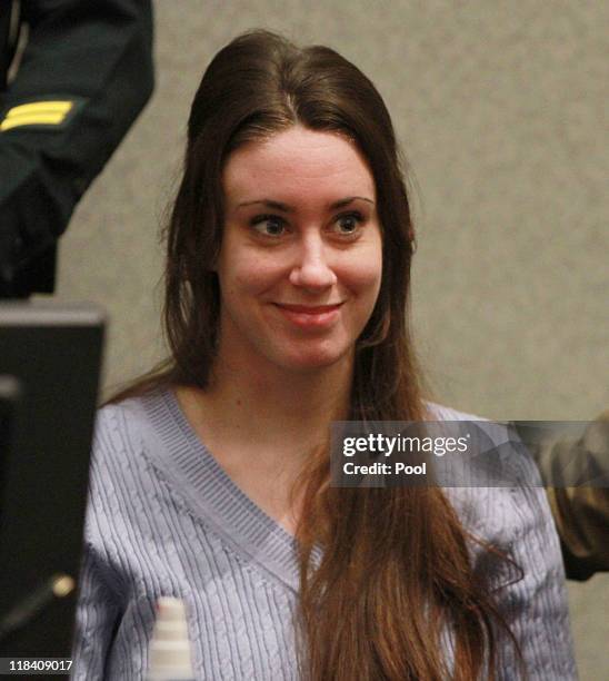 Casey Anthony smiles before the start of her sentencing hearing on charges of lying to a law enforcement officer at the Orange County Courthouse July...