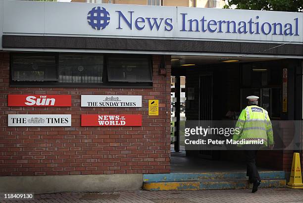 Policeman walks through the security gates at News International's Wapping plant on July 7, 2011 in London, England. Following further serious...
