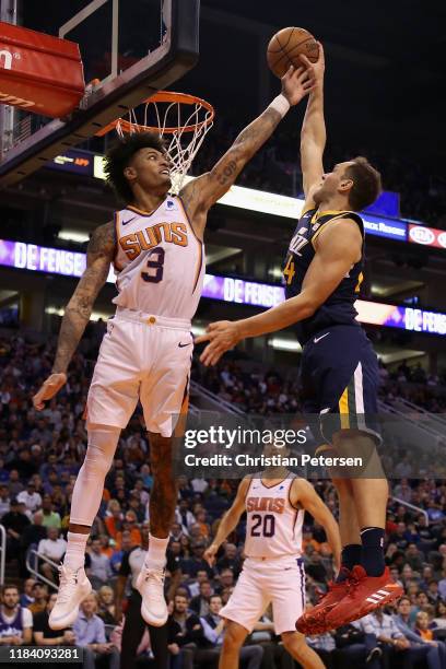 Bojan Bogdanovic of the Utah Jazz slam dunks the ball against Kelly Oubre Jr. #3 of the Phoenix Suns during the second half of the NBA game at...