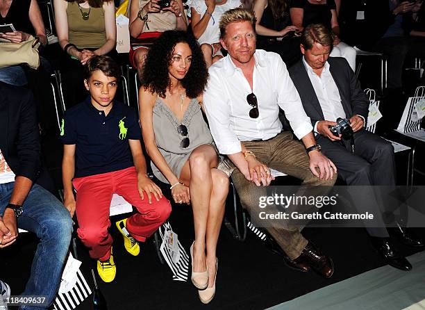 Boris Becker and wife Lilly with his son Elias Balthasar attend the Perret Schaad Show during Mercedes-Benz Fashion Week Berlin Spring/Summer 2012 at...