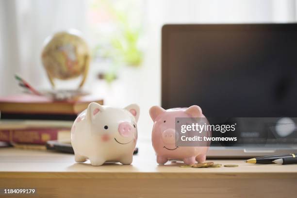 financial planning table top objects still life. - choosing between two things stock pictures, royalty-free photos & images