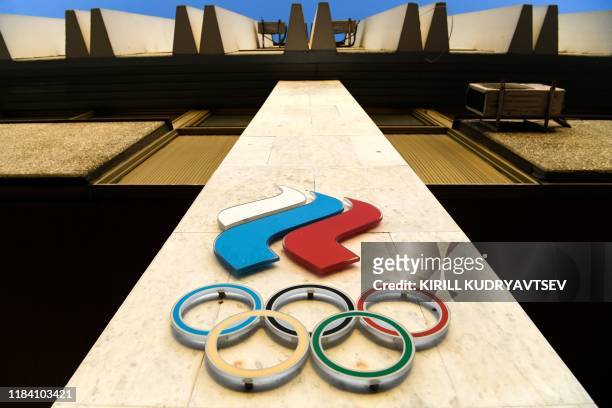 Russian Olympic committee logo is pictured on the Russian Olympic committee headquarter in Moscow on November 23, 2019. - The Athletics Integrity...
