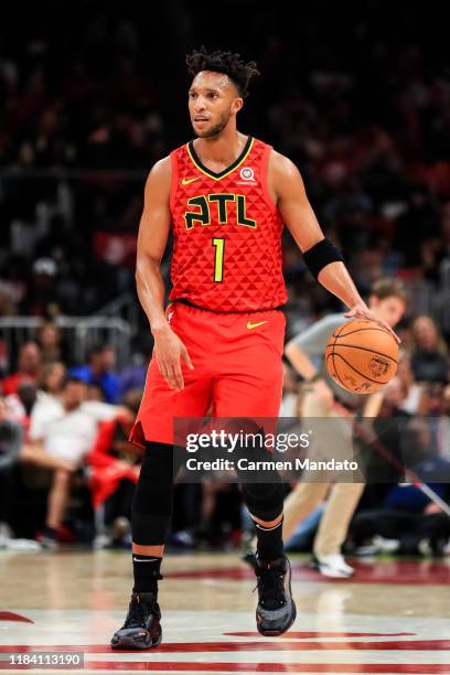 Evan Turner of the Atlanta Hawks dribbles the ball during a game against the Orlando Magic at State Farm Arena on October 26, 2019 in Atlanta,...