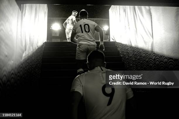England's captain Owen Farrell, Ben Youngs and George Ford of England walk up the steps from the dressing room onto the field of play during the...