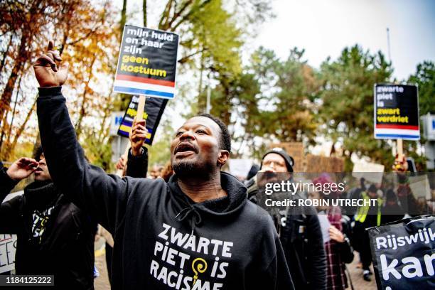 Dutch anti-discrimination activist Jerry Afriyie , leader of the 'Kick Out Zwarte Piet' movement, demonstrates during the arrival of Saint Nicholas,...