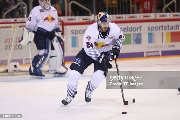 Bobby Sanguinetti of EHC Red Bull Muenchen controls the ball during the DEL match between Dueseldorfer EG and EHC Red Bull Muenchen at ISS Dome on...