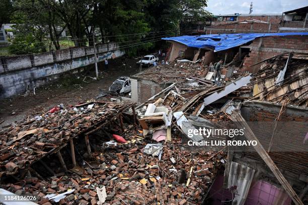 Soldiers checks a house destroyed by a blast targeting a police station in Santander de Quilichao, Cauca department, on November 23, 2019. - Three...