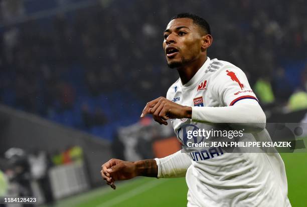 Lyon's French midfielder Jeff Reine-Adelaide celebrates after scoring a goal during the French L1 football match between Lyon and Nice on November 23...
