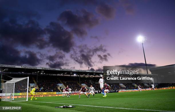 Christian Pulisic of Chelsea rises for a header as the sun goes down during the Premier League match between Burnley FC and Chelsea FC at Turf Moor...