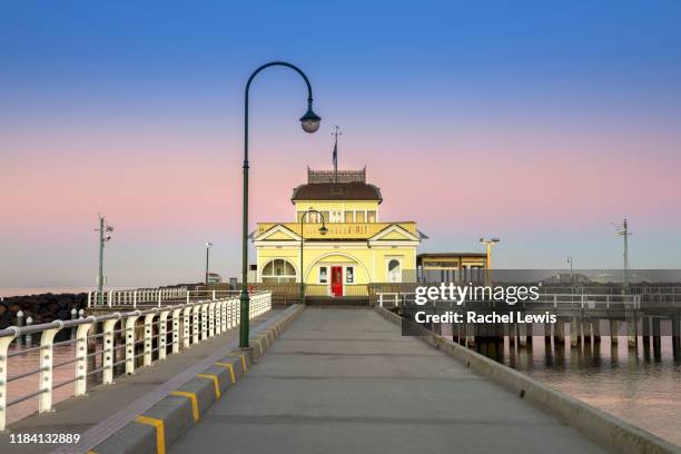 iconic st kilda pavilion at the end of st kilda pier at dawn - st kilda beach stock pictures, royalty-free photos & images