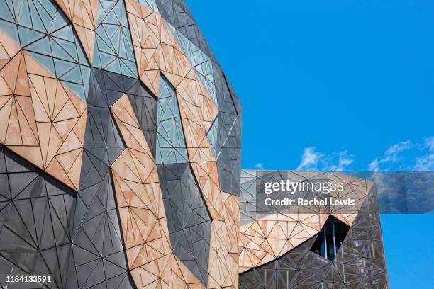 architectural detail of federation square sandstone building façade featuring pinwheel tiling - federation square fotografías e imágenes de stock