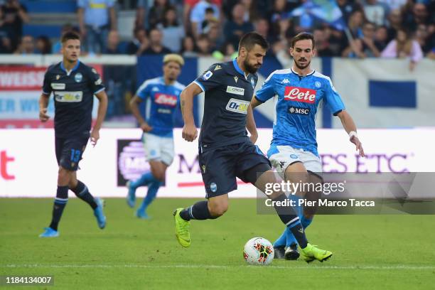 Nenand Tomovic of Spal competes for the ball with Fabian Ruiz of SSC Napoli during the Serie A match between SPAL and SSC Napoli at Stadio Paolo...