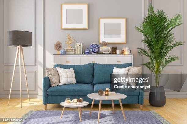 wohnzimmer-interieur mit bilderrahmen an grauen wänden - living room wallpaper stock-fotos und bilder