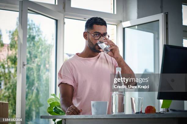 businessman drinking water - drinking water stock pictures, royalty-free photos & images