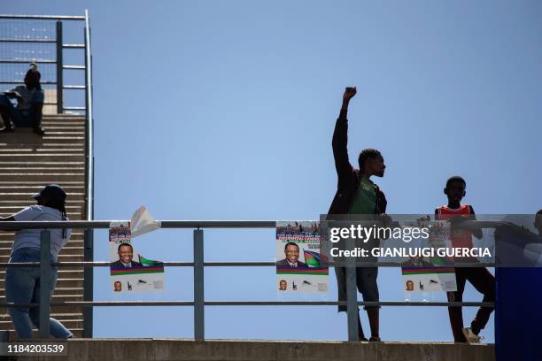 Supporters of the Namibian incumbent president and ruling party South West Africa People's Organisation presidential candidate Hage Geingob cheer and...