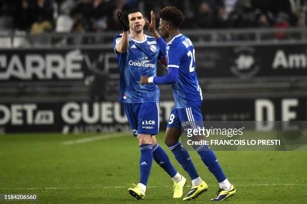 Strasbourg's Nuno Da Costa is congratulated by teammates after scoring a goal during the French L1 football match between Amiens and Strasbourg on...