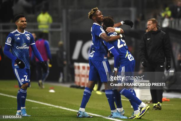 Strasbourg's Cape Verdean forward Nuno Da Costa celebrates with teammates after scoring a goal during the French L1 football match between Amiens and...