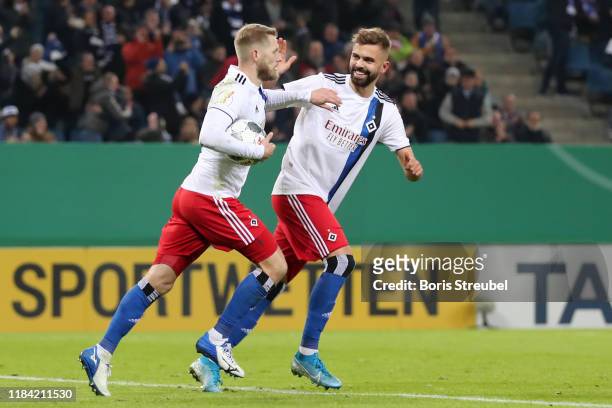 Aaron Hunt of Hamburger SV celebrates after scoring his team's first goal from the penalty spot with Lukas Hinterseer of Hamburger SV during the DFB...