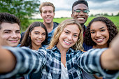 Multi_ethnic Teenagers Taking a Self Portrait stock photo