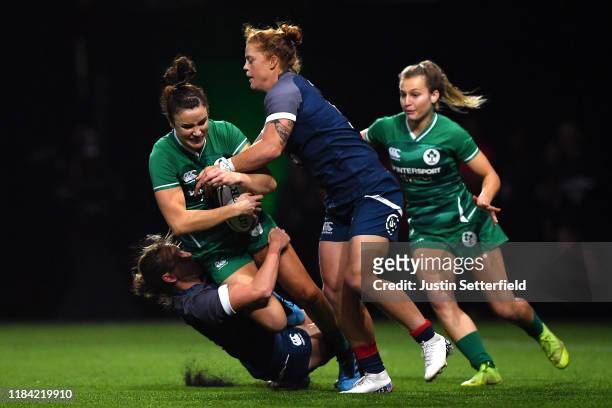 Louise Galvin of Ireland is tackled by Alev Kelter of USA and Stephanie Rovetti of USA during the Rugby X at The O2 Arena on October 29, 2019 in...