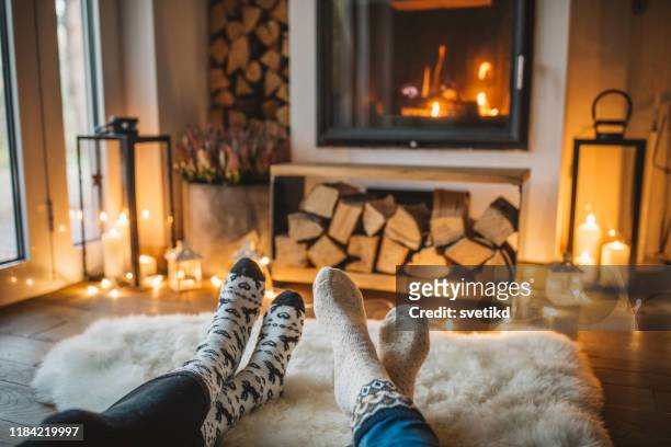 winter day by fireplace - winter stock pictures, royalty-free photos & images
