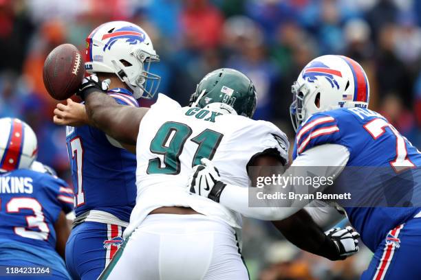 Fletcher Cox of the Philadelphia Eagles knocks the ball out of Josh Allen of the Buffalo Bills hand during the first quarter of an NFL game at New...