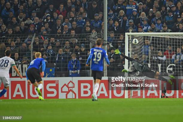 Alessandro Schoepf of Schalke scores his teams first goal against goalkeeper Stefan Ortega Moreno of Bielefeld during the DFB Cup second round match...