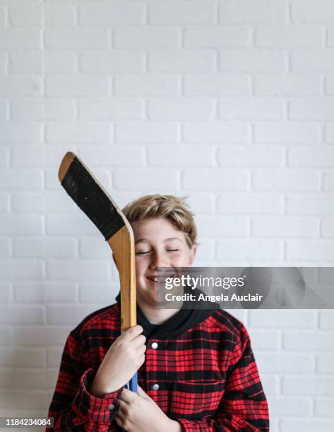 canadian boy tween hockey player - youth hockey stock pictures, royalty-free photos & images