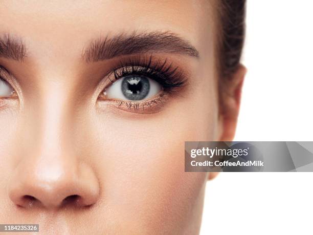 close-up woman face - woman blue eyes stock pictures, royalty-free photos & images