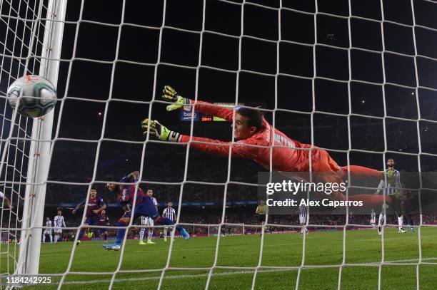 Arturo Vidal of FC Barcelona scores his team's second goal past Jordi Masip of Valladolid during the Liga match between FC Barcelona and Real...