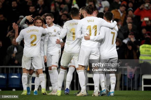 Luka Modric of Real Madrid celebrates with his teammates after scoring a goal during the Spanish league football match between Real Madrid CF and...