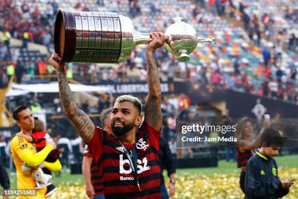 Gabriel Barbosa of Flamengo celebrates with the trophy after winnig the final match of Copa CONMEBOL Libertadores 2019 between Flamengo and River...