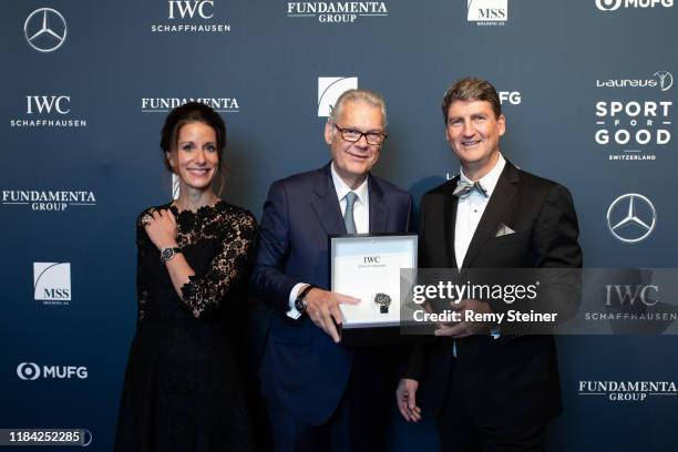 Managing Director IWC Switzerland Linus Fuchs and CMO IWC Schaffhausen Franziska Gsell hand over the Pilot's Watch Perpetual Calendar Chronograph...