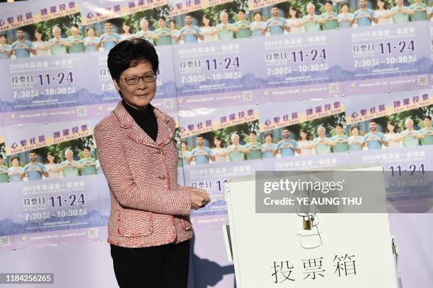 Hong Kong Chief Executive Carrie Lam casts her vote during the district council elections in Hong Kong on November 24, 2019. Hong Kong voted in...