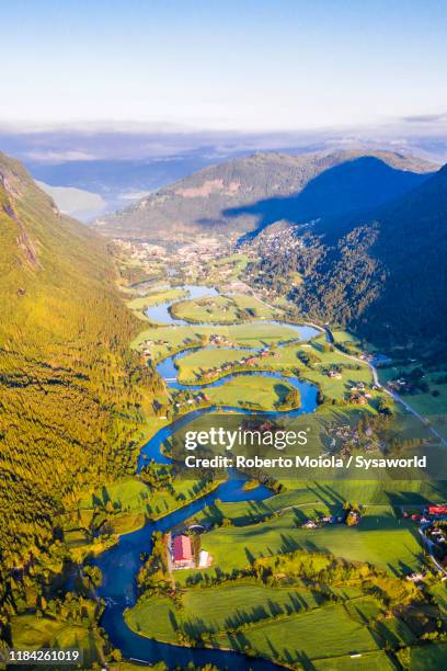 stryneelva river and fields, stryn, norway - olden foto e immagini stock