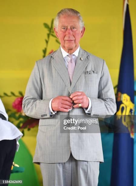 Prince Charles, Prince of Wales undertakes a series of Investitures during a ceremony at the Recreational Leaf Hut at Government House in Honiara,...
