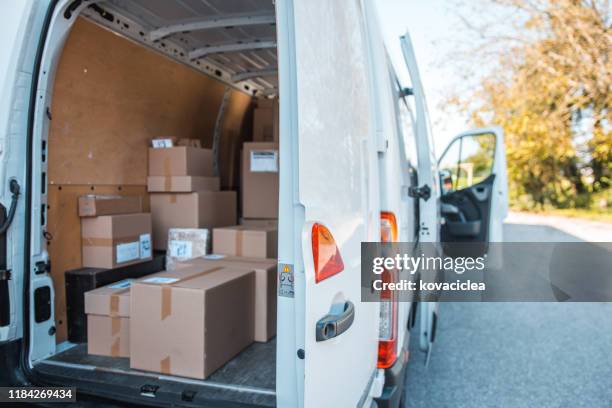 delivery van full of packages - moving van stock pictures, royalty-free photos & images
