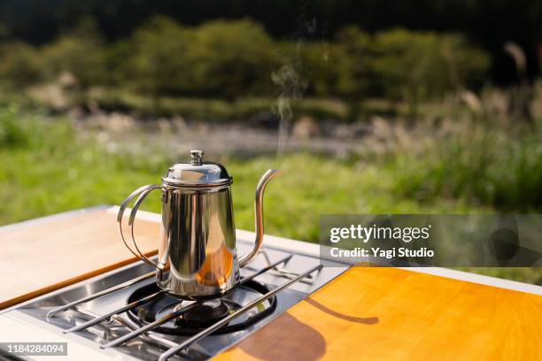 enjoy outdoor cooking at the camp - camping stove stock pictures, royalty-free photos & images